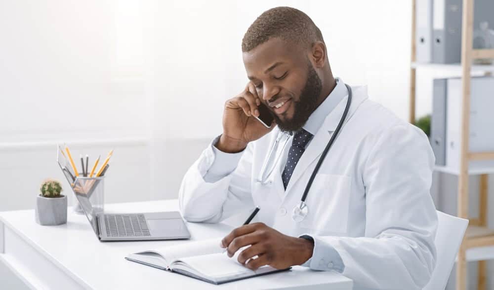 african american doctor giving telemedicine services