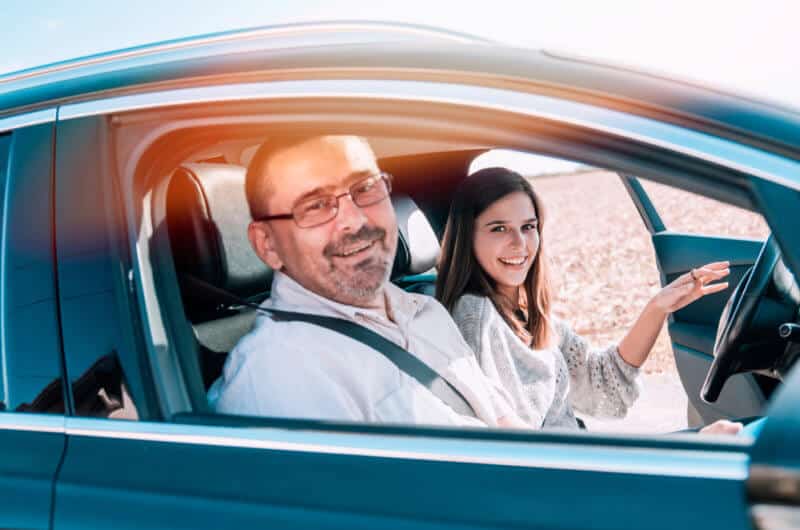 father with daughter in car driving for the first time