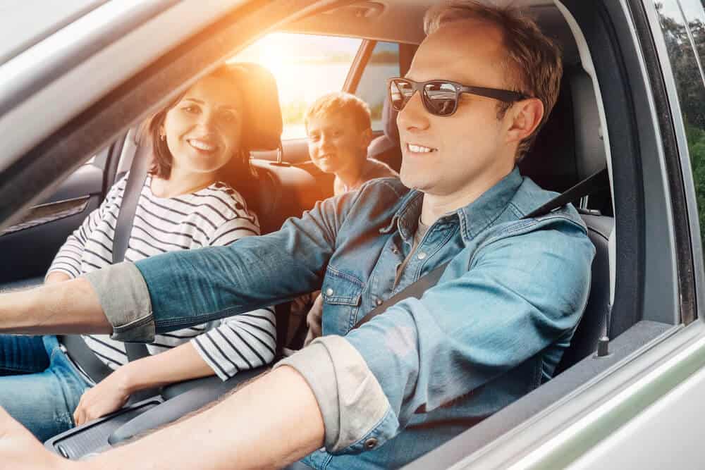 caucasian family in car on road trip