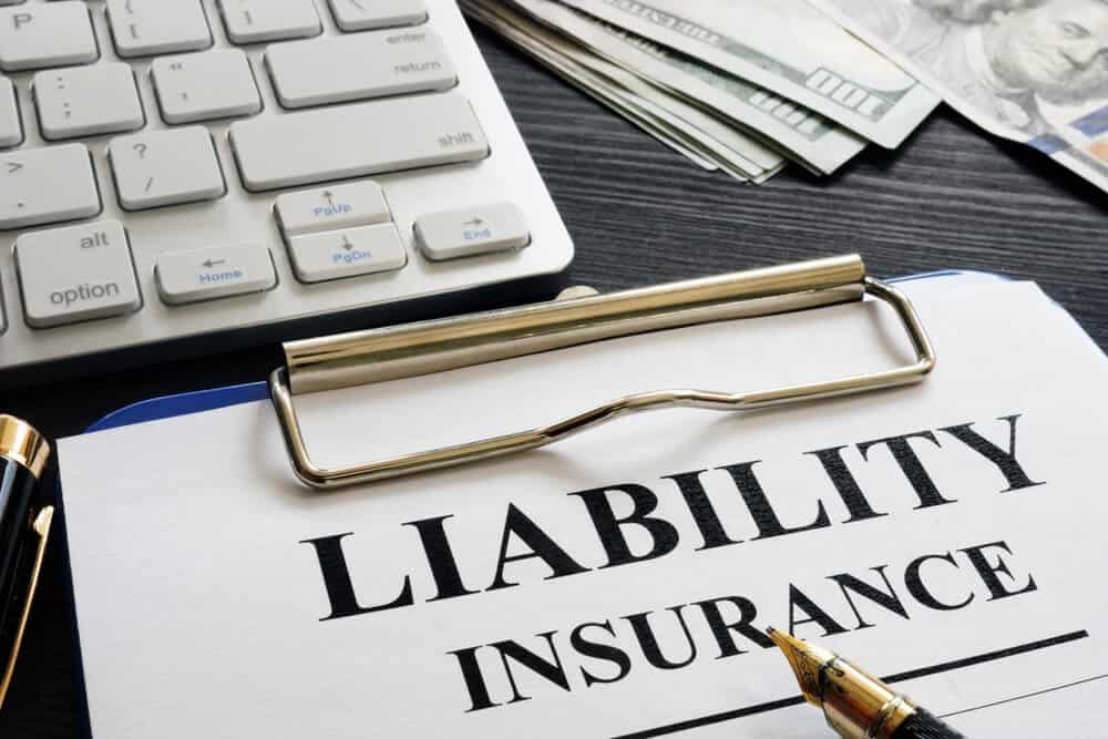 liability insurance document on clipboard