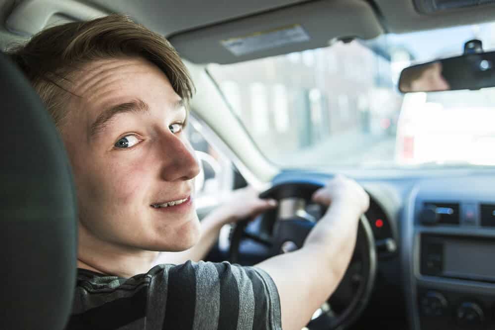 teen driver behind the wheel of a car