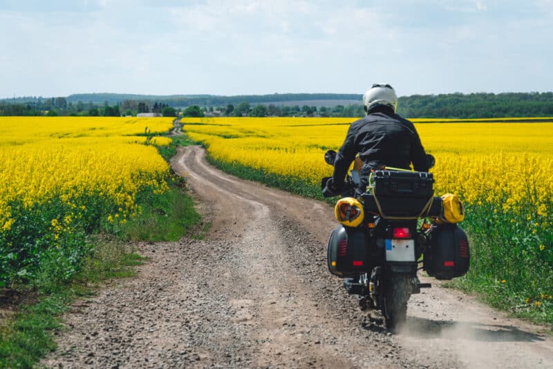 man on motorcycle in spring landscape