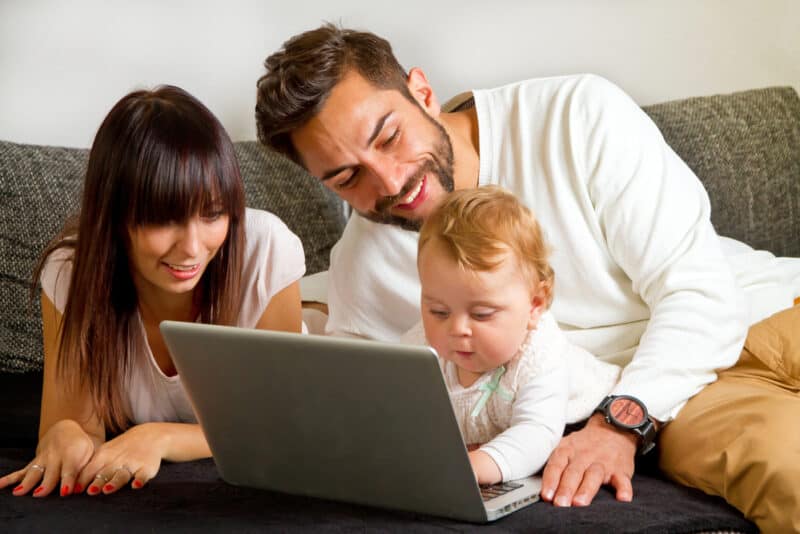 young family on computer with baby