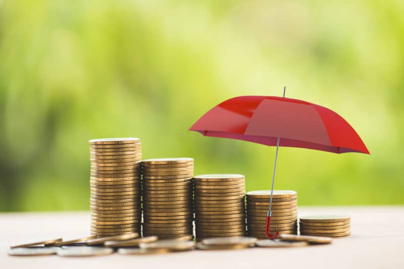 red umbrella over coins