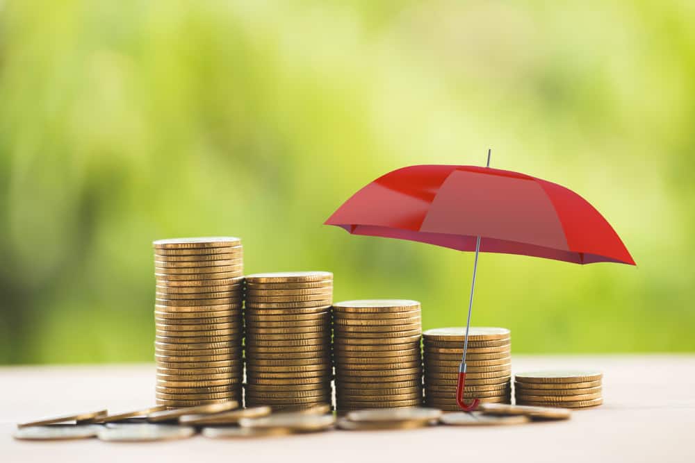 red umbrella over coins